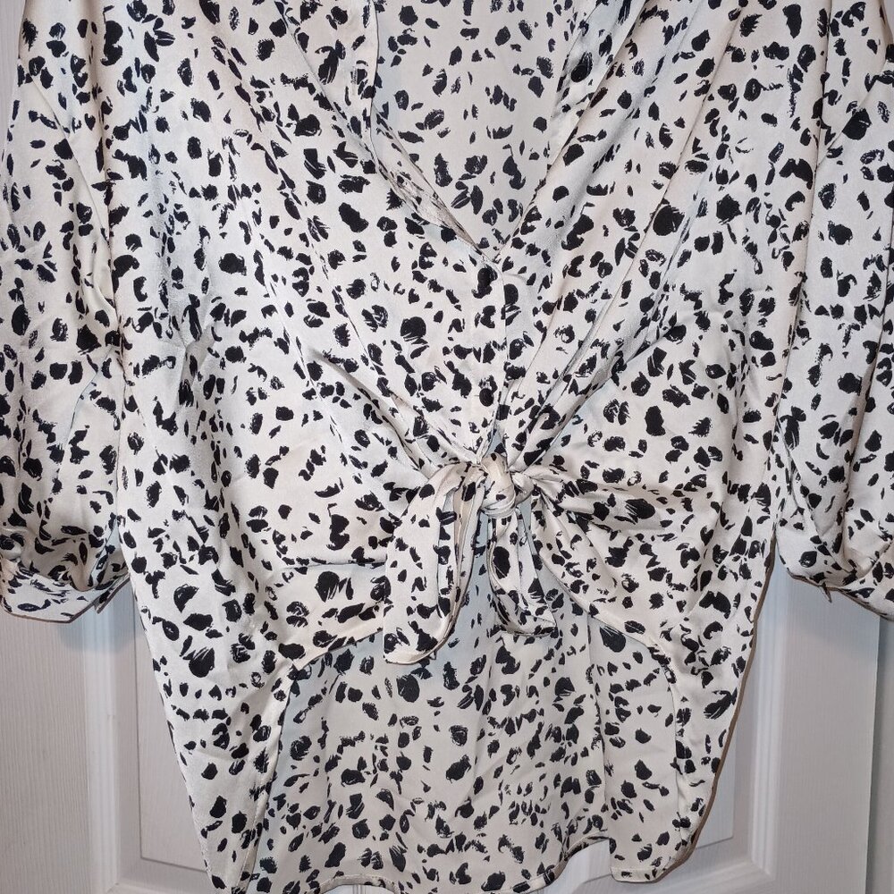 Cute tie front or button down top.
